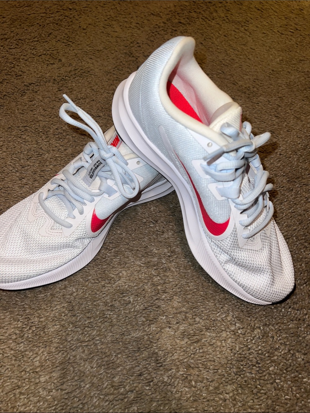 Nike Women’s White  and light blue Athletic Shoes with red  Swoosh